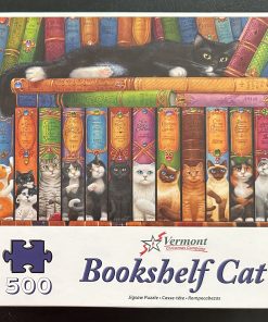 50568 - Vermont Christmas Company - 24" x 18″ – Randal Spangler – Bookshelf Cat - 500 Piece